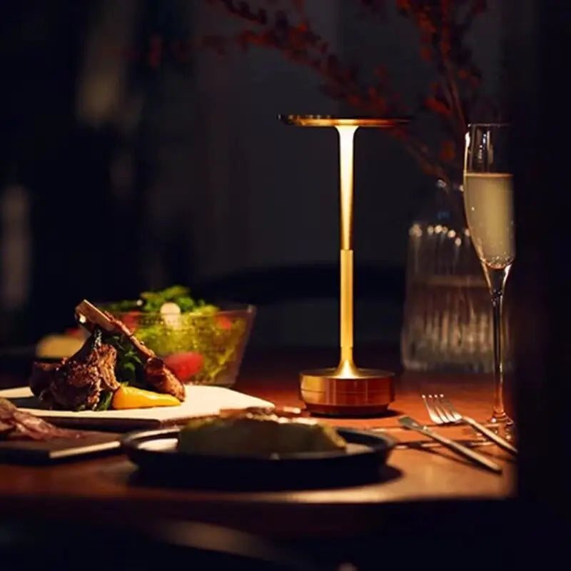 Cordless table lamp glowing on a dinner table